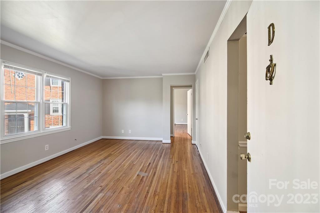 914 McAlway Road Charlotte, NC 28211 - Photo 5 of 44 wooden floor in an empty room with a window