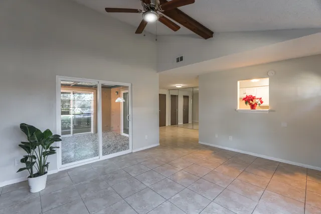 a view of an empty room and a window