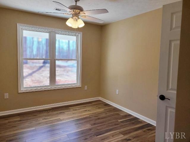 2329 Stonewall Road Concord, VA 24538 - Photo 12 of 15 a view of an empty room with wooden floor and a window