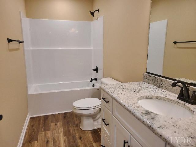 2329 Stonewall Road Concord, VA 24538 - Photo 13 of 15 a bathroom with a granite countertop sink toilet and shower