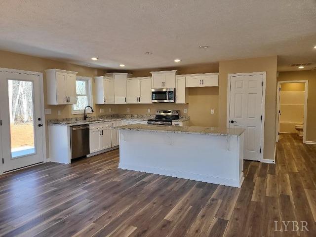 2329 Stonewall Road Concord, VA 24538 - Photo 3 of 15 a kitchen with stainless steel appliances granite countertop a stove a sink and a refrigerator