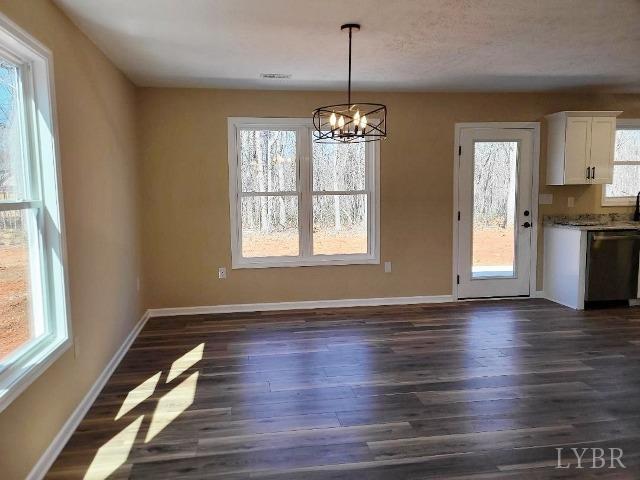 2329 Stonewall Road Concord, VA 24538 - Photo 6 of 15 a view of an empty room with wooden floor and a window