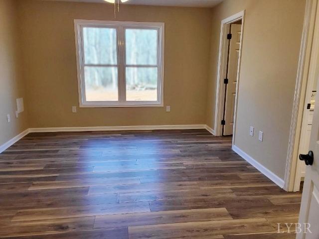 2329 Stonewall Road Concord, VA 24538 - Photo 8 of 15 an empty room with wooden floor and windows