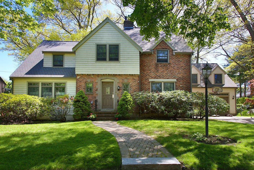 a front view of a house with garden