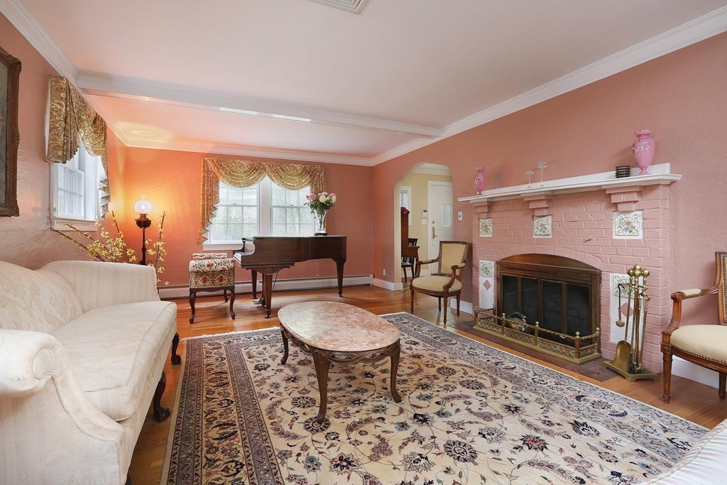 26 Rowena Road Newton, MA 02459 - Photo 2 of 9 a living room with furniture and a fireplace
