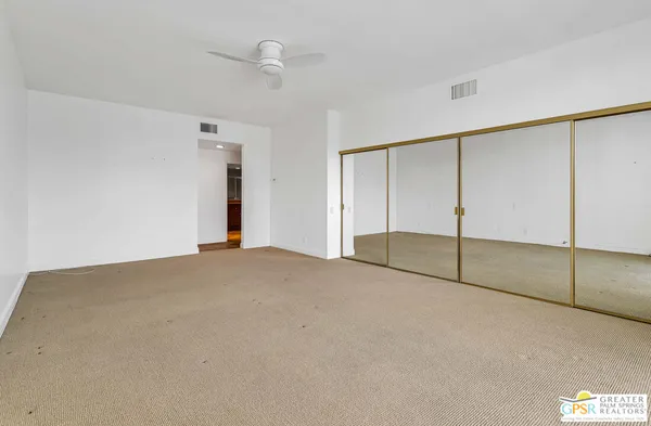 an empty room with fan