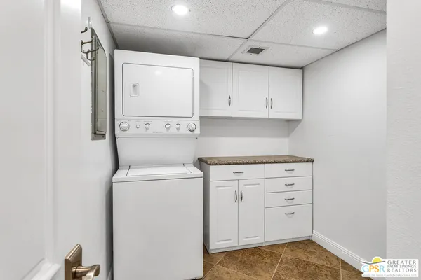 a view of storage and utility room with washer and dryer