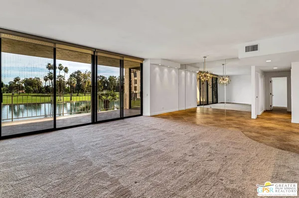 a view of an empty room with a sliding door