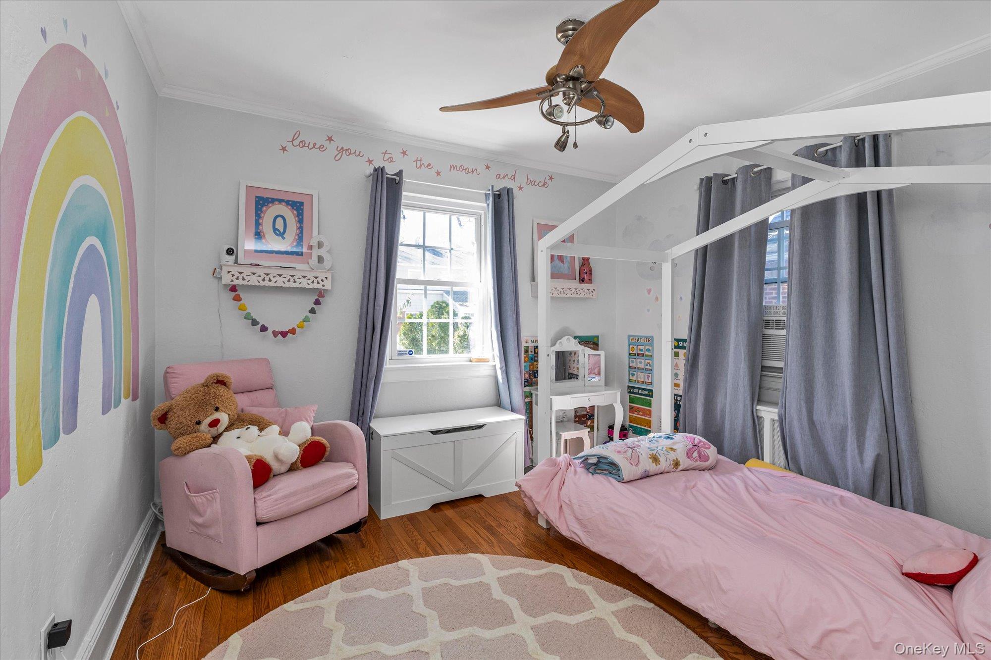 81 Stuart Street Lynbrook, NY 11563 - Photo 11 of 23 a bedroom with furniture and a window