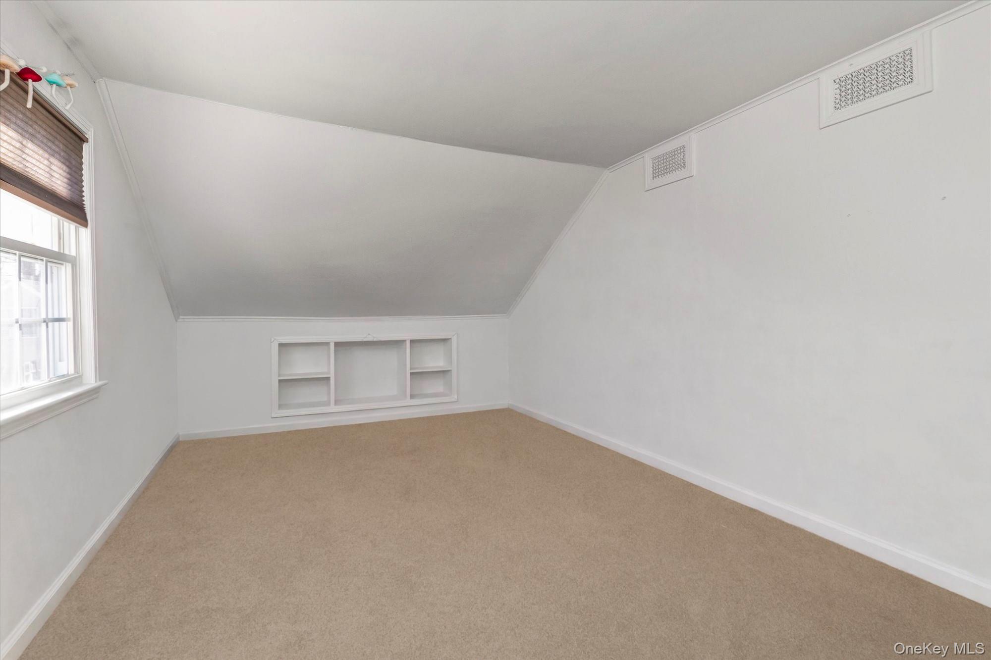 81 Stuart Street Lynbrook, NY 11563 - Photo 13 of 23 an empty room with a window