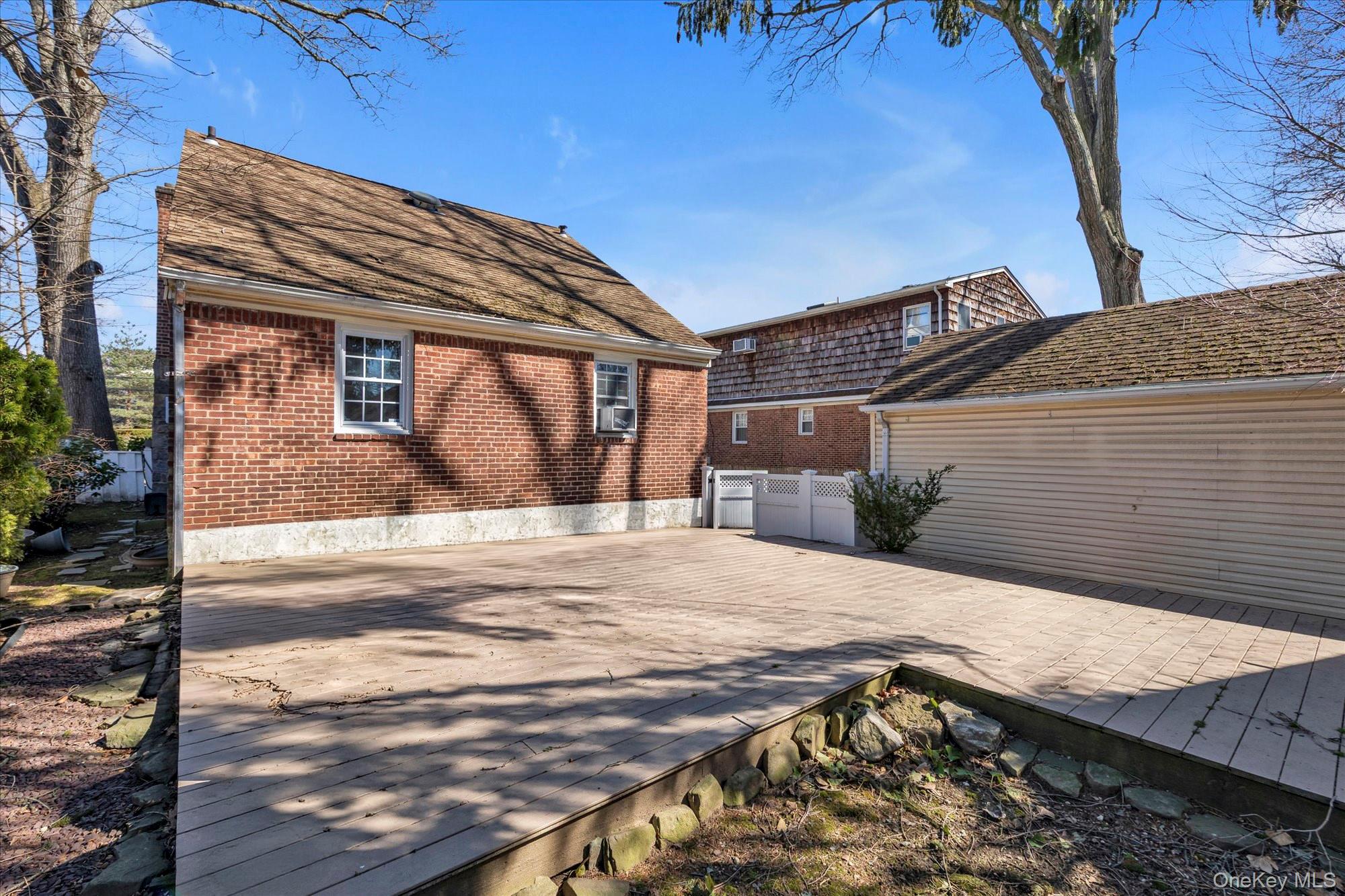81 Stuart Street Lynbrook, NY 11563 - Photo 21 of 23 a view of a backyard