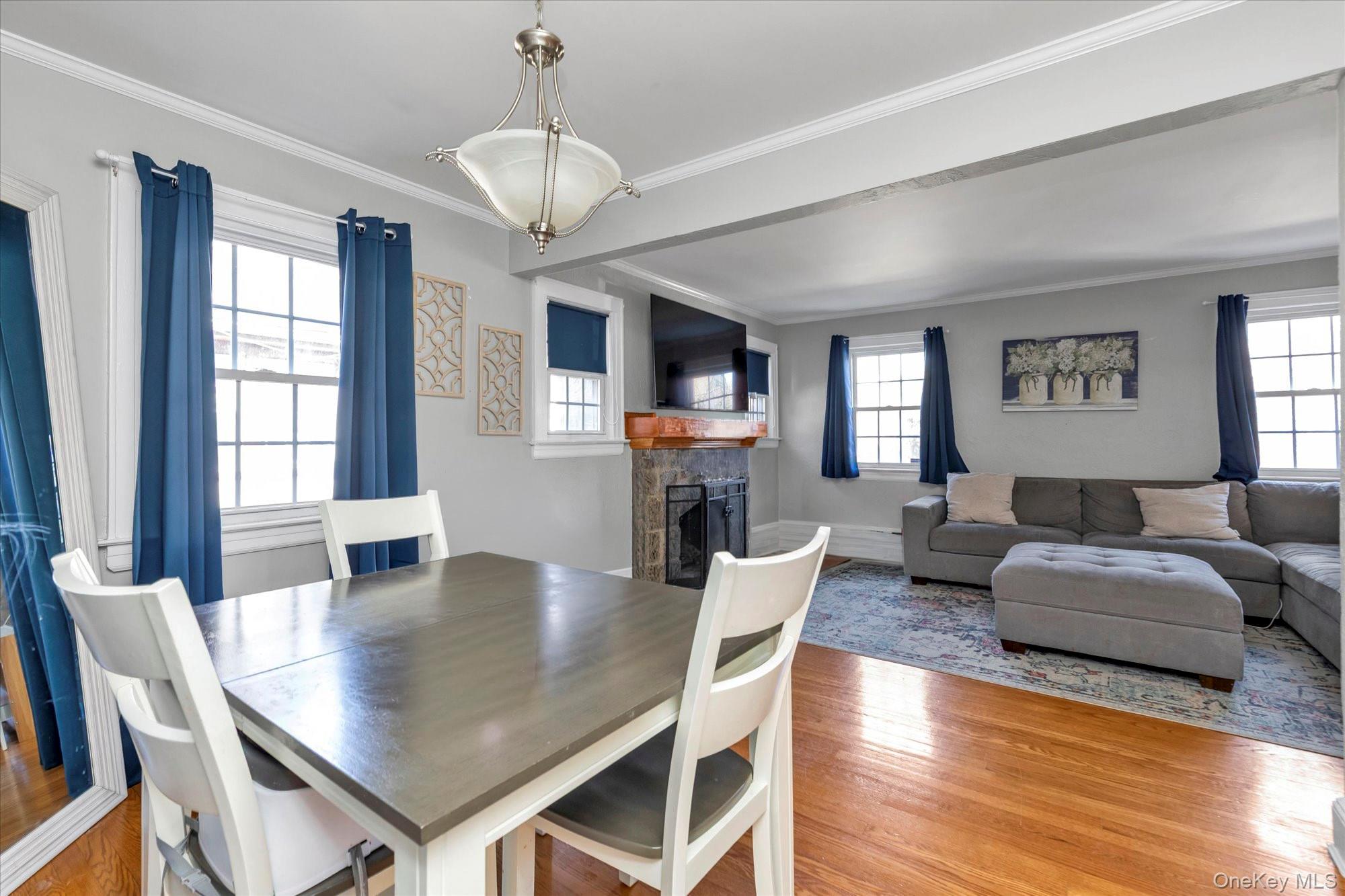 81 Stuart Street Lynbrook, NY 11563 - Photo 5 of 23 a view of a dining room with furniture window and wooden floor