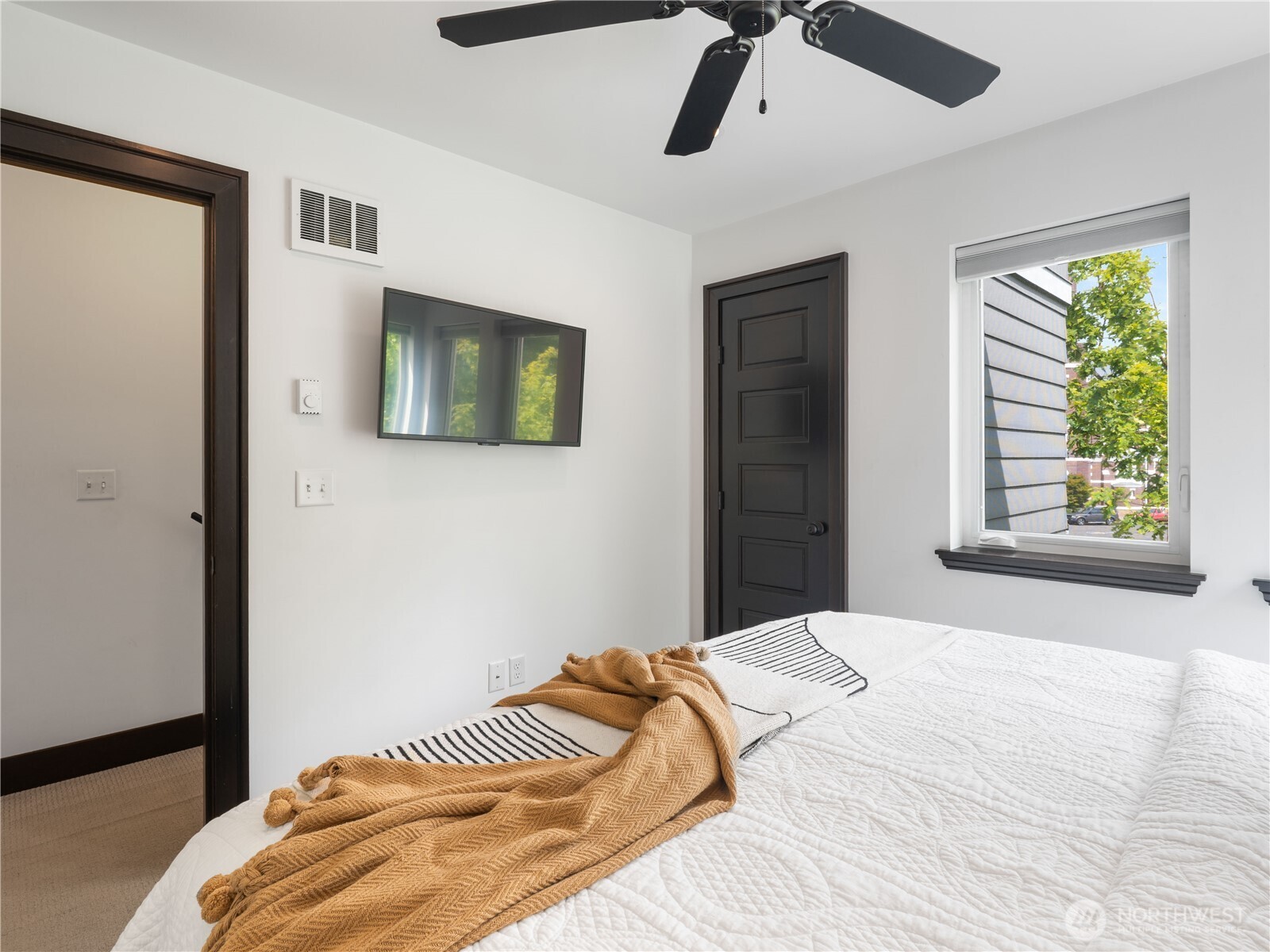 2019 Cornwall Avenue Bellingham, WA 98225 - Photo 23 of 40 a bedroom with a bed and a window