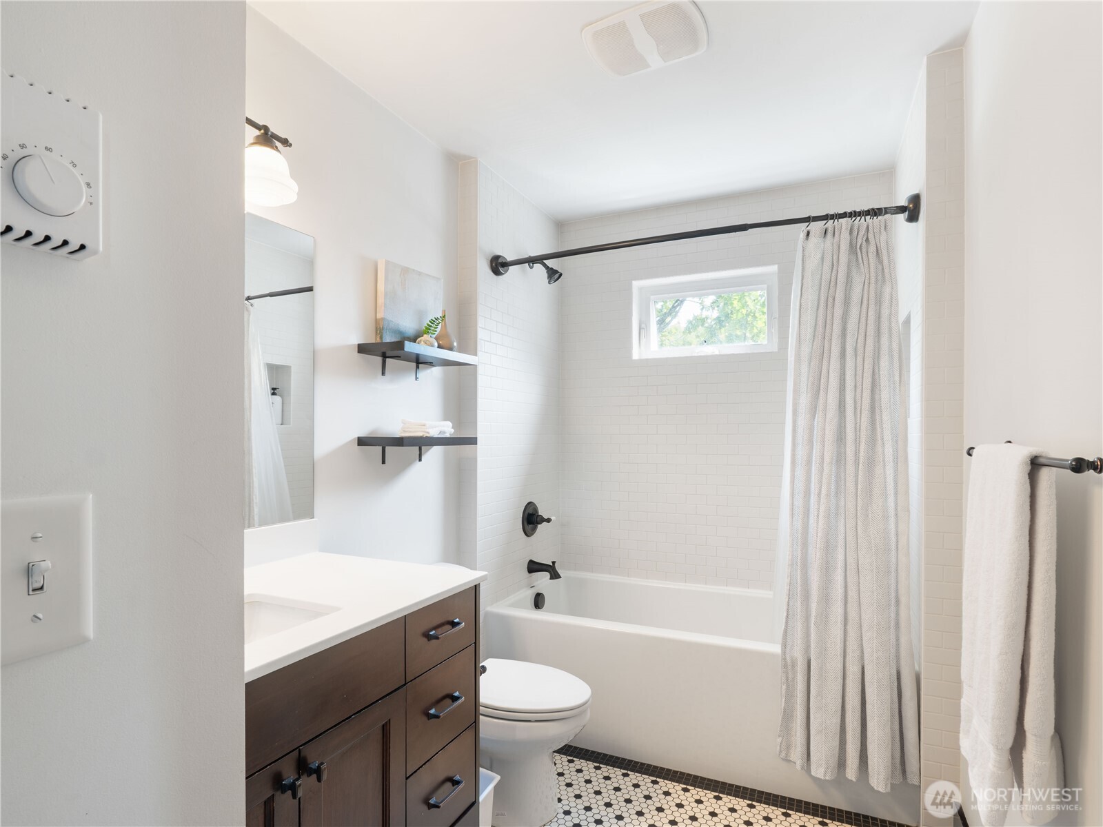 2019 Cornwall Avenue Bellingham, WA 98225 - Photo 24 of 40 a bathroom with a granite countertop sink toilet and shower