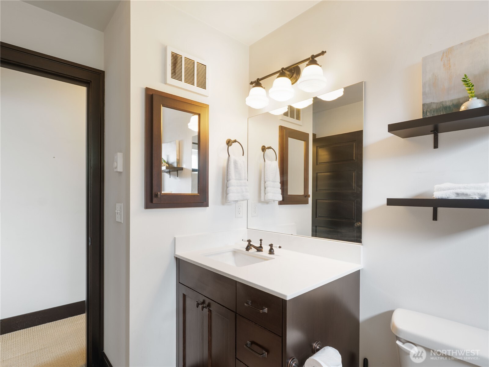 2019 Cornwall Avenue Bellingham, WA 98225 - Photo 25 of 40 a bathroom with a sink vanity and a mirror