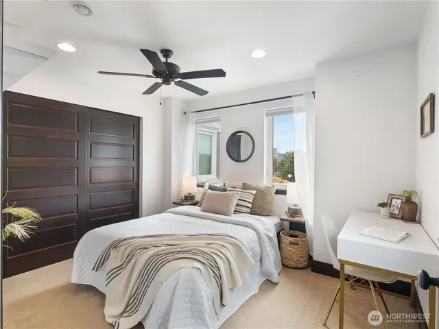 a bedroom with a bed and a table