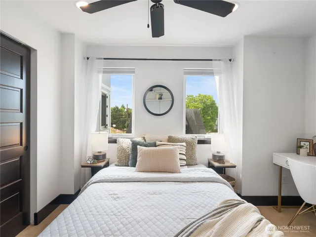 a bedroom with a bed and a window