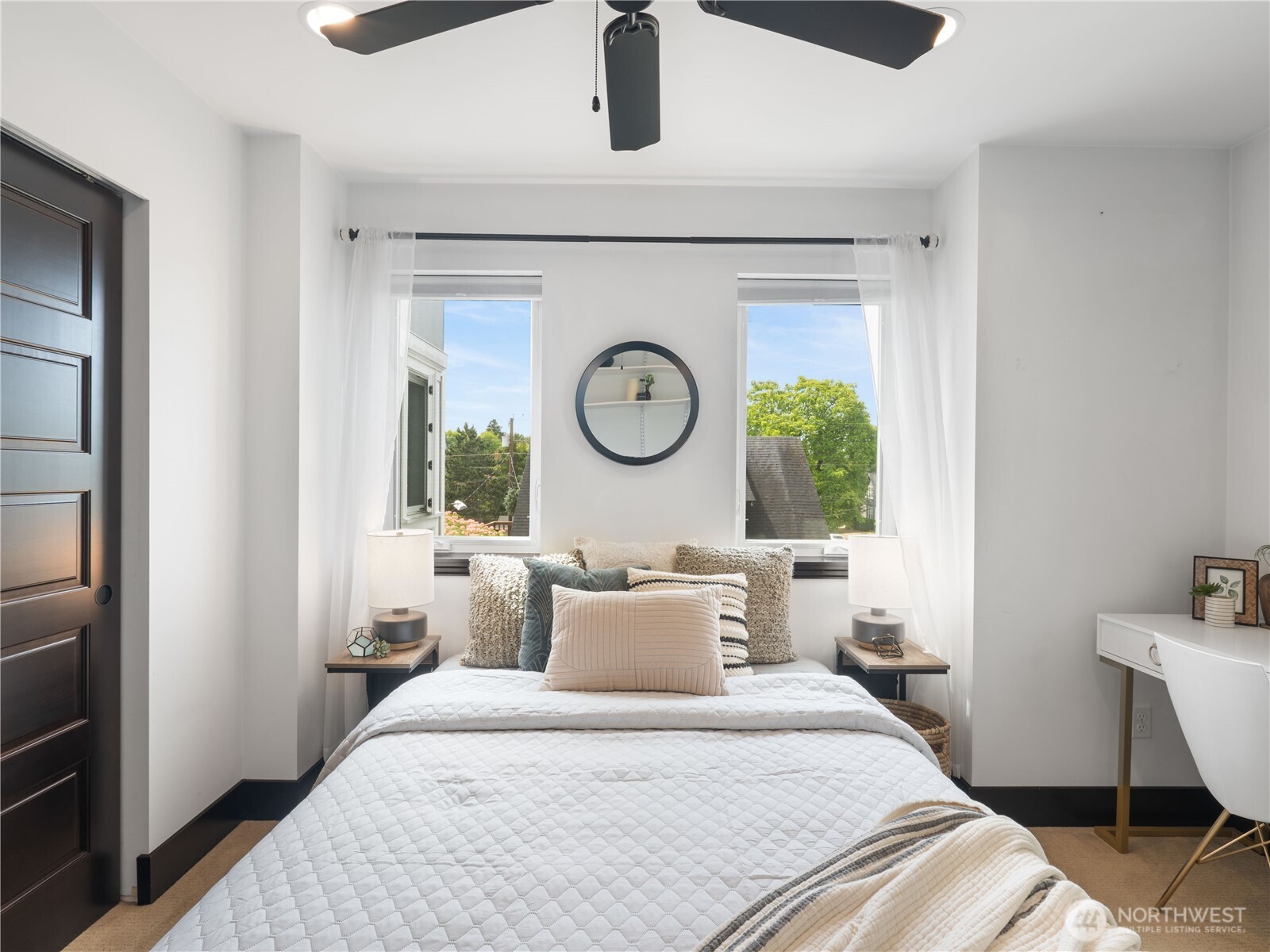 2019 Cornwall Avenue Bellingham, WA 98225 - Photo 29 of 40 a bedroom with a bed and a window