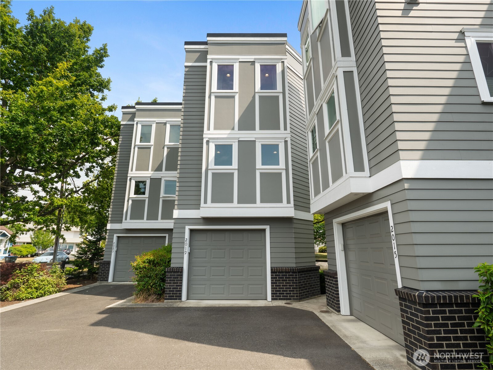 2019 Cornwall Avenue Bellingham, WA 98225 - Photo 34 of 40 a front view of a house with a yard