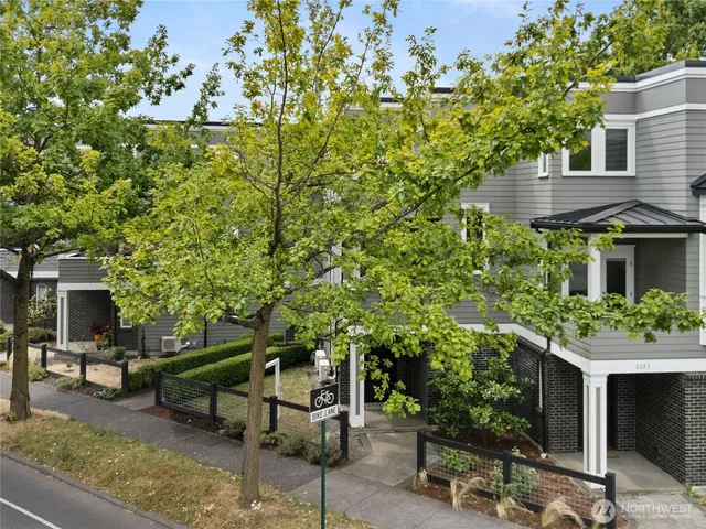 a view of a house with backyard sitting area and garden