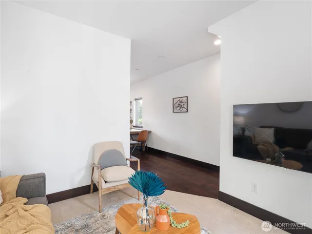 a living room with furniture and a rug