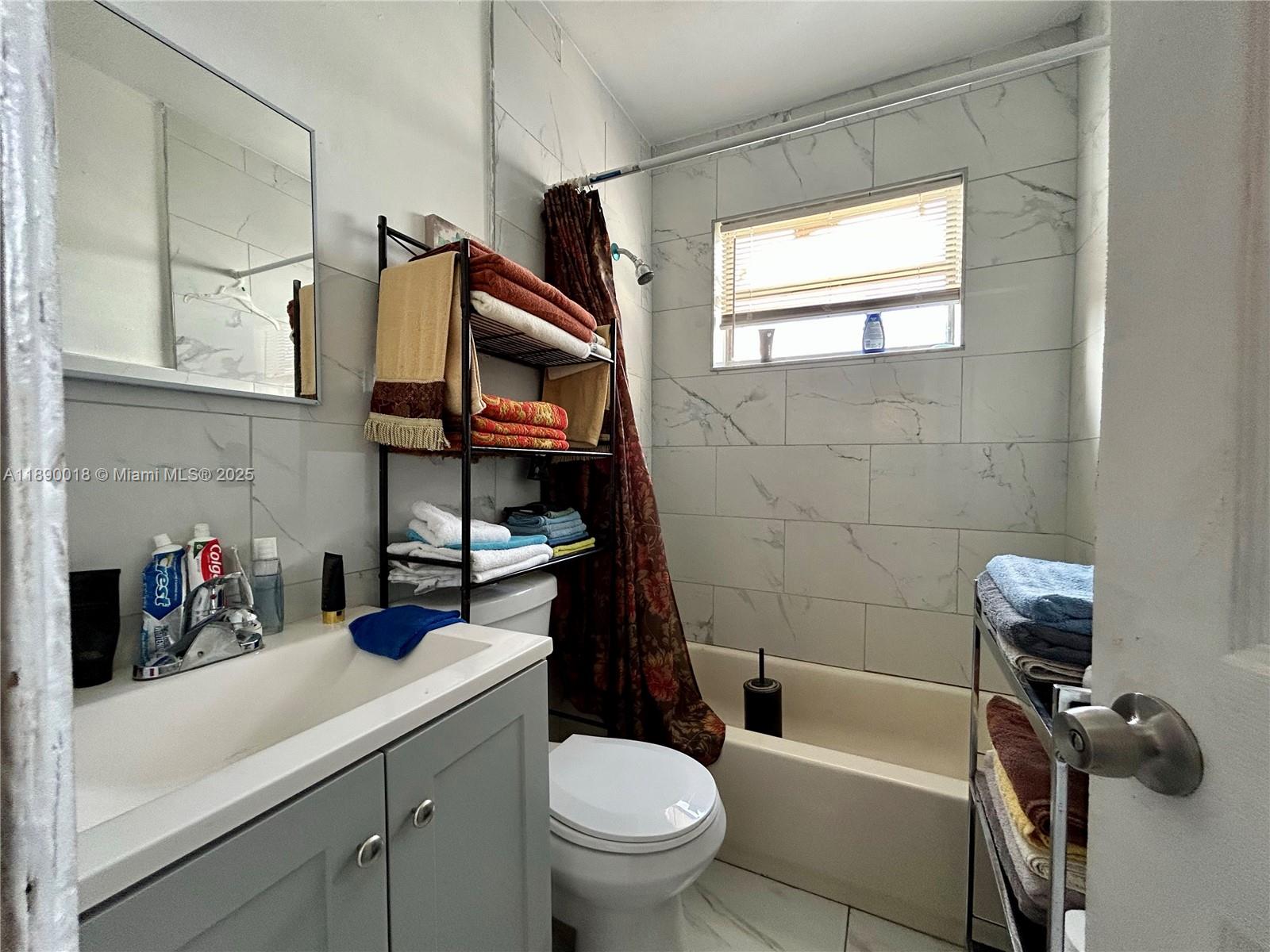 2013 Washington Avenue Opa-Locka, FL 33054 - Photo 13 of 19 a bathroom with a sink a toilet and shower