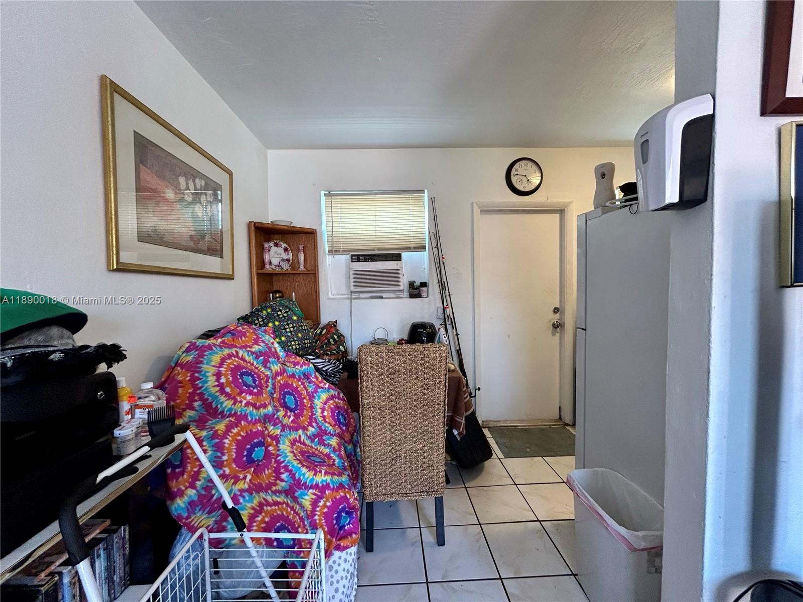 2013 Washington Avenue Opa-Locka, FL 33054 - Photo 9 of 19 a bedroom with a bed and a mirror