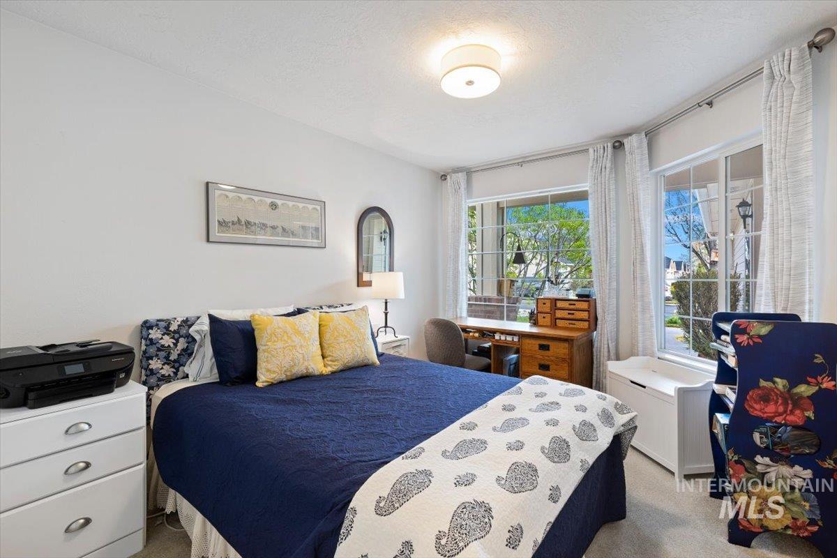 3357 West Fieldstream Lane Meridian, ID 83646 - Photo 13 of 24 Bedroom featuring light carpet and a textured ceiling