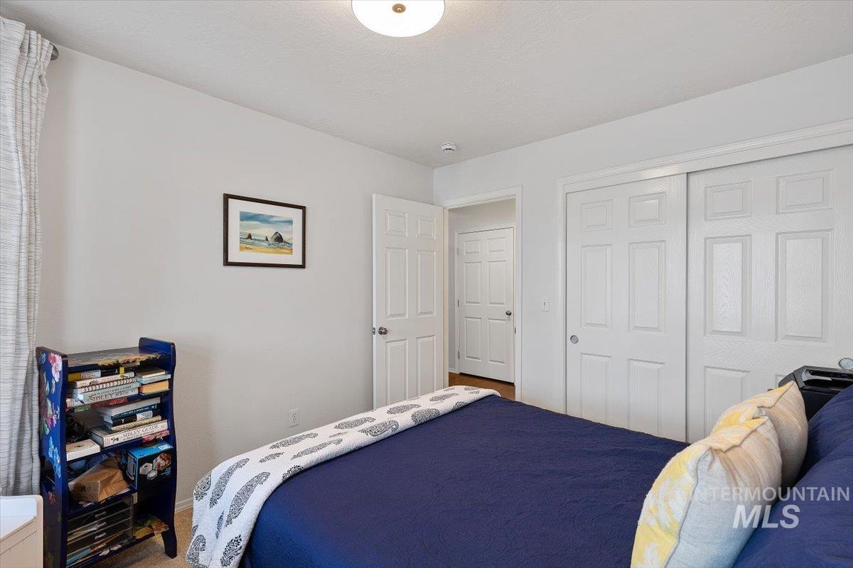 3357 West Fieldstream Lane Meridian, ID 83646 - Photo 14 of 24 Bedroom with a closet and carpet flooring