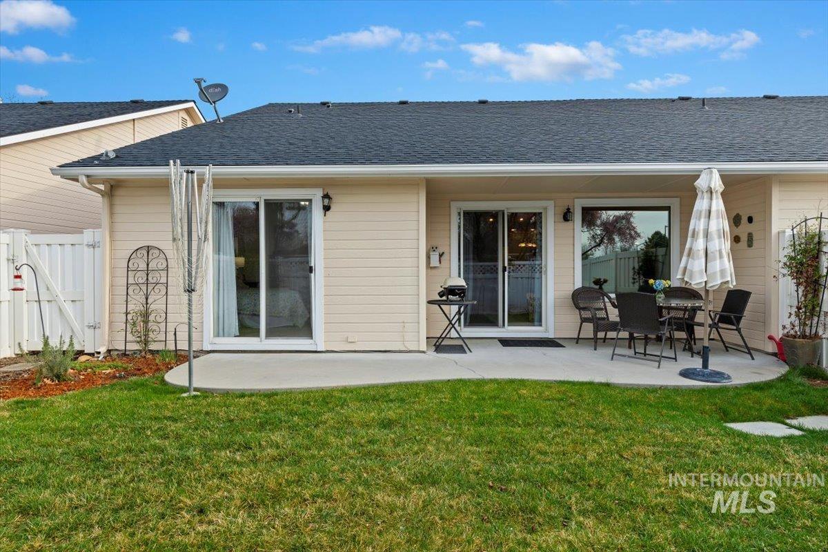 3357 West Fieldstream Lane Meridian, ID 83646 - Photo 21 of 24 Back of house featuring a patio area, roof with shingles, and a gate