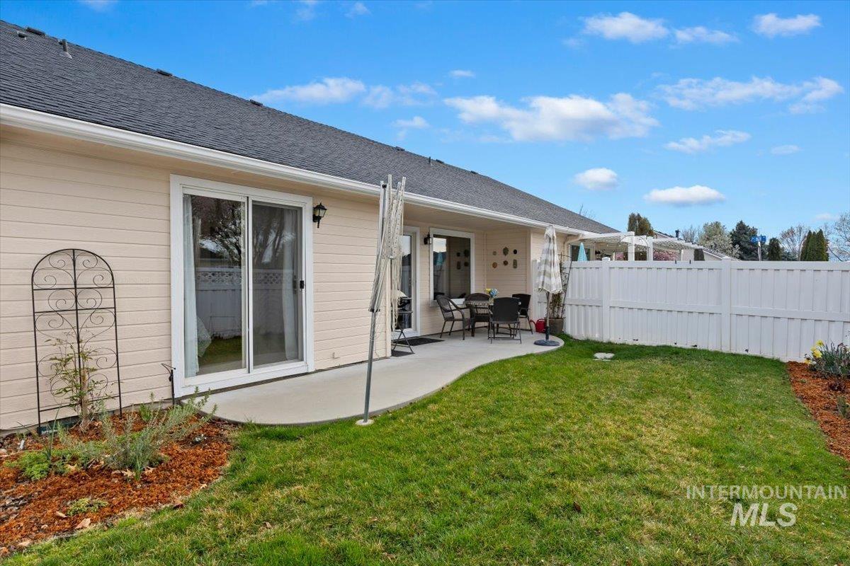 3357 West Fieldstream Lane Meridian, ID 83646 - Photo 22 of 24 Rear view of house with a patio area and roof with shingles
