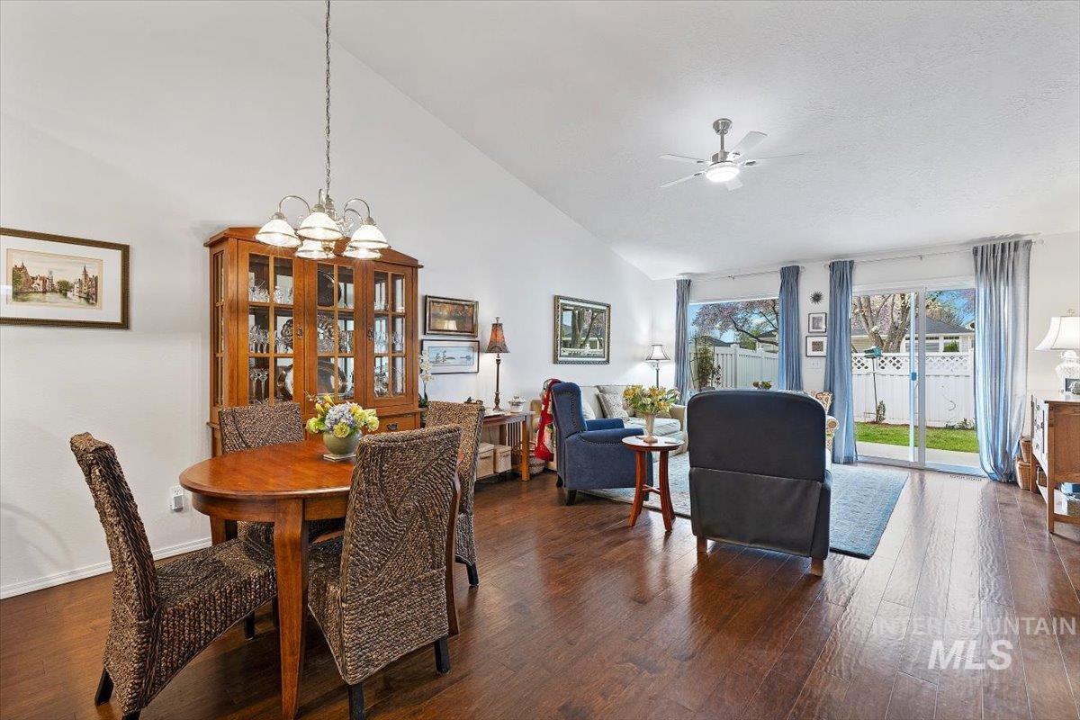 3357 West Fieldstream Lane Meridian, ID 83646 - Photo 10 of 24 Dining space featuring dark wood finished floors, suspended lighting, a ceiling fan, and vaulted ceiling