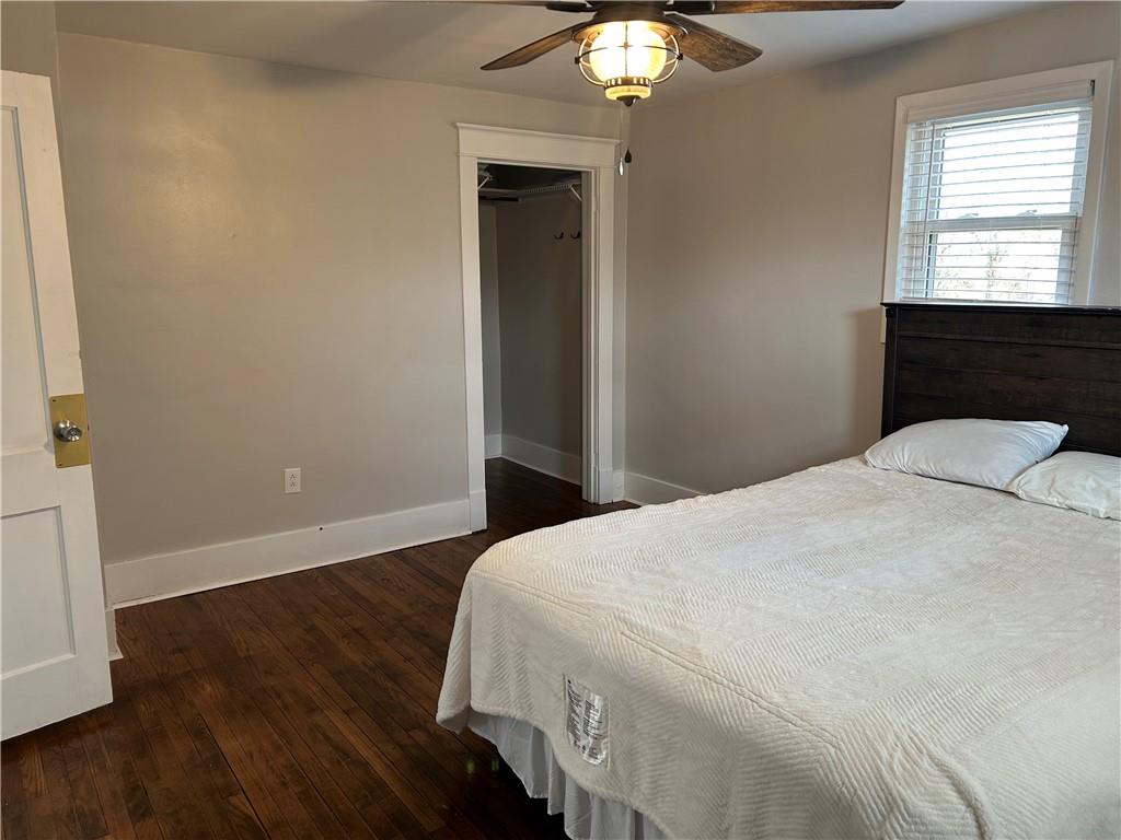 230 Maple Street Everson, PA 15631 - Photo 29 of 32 a bedroom with a bed and a chandelier
