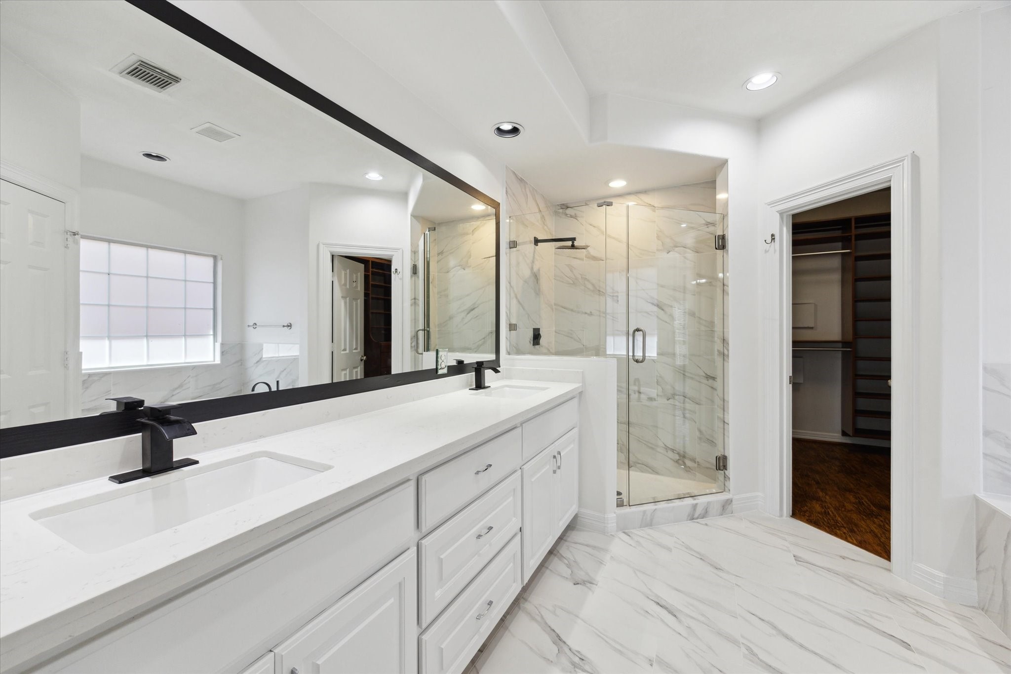 13639 Brookbluff Lane Houston, TX 77077 - Photo 15 of 22 Large ensuite bath with dual vanities and walk in shower.