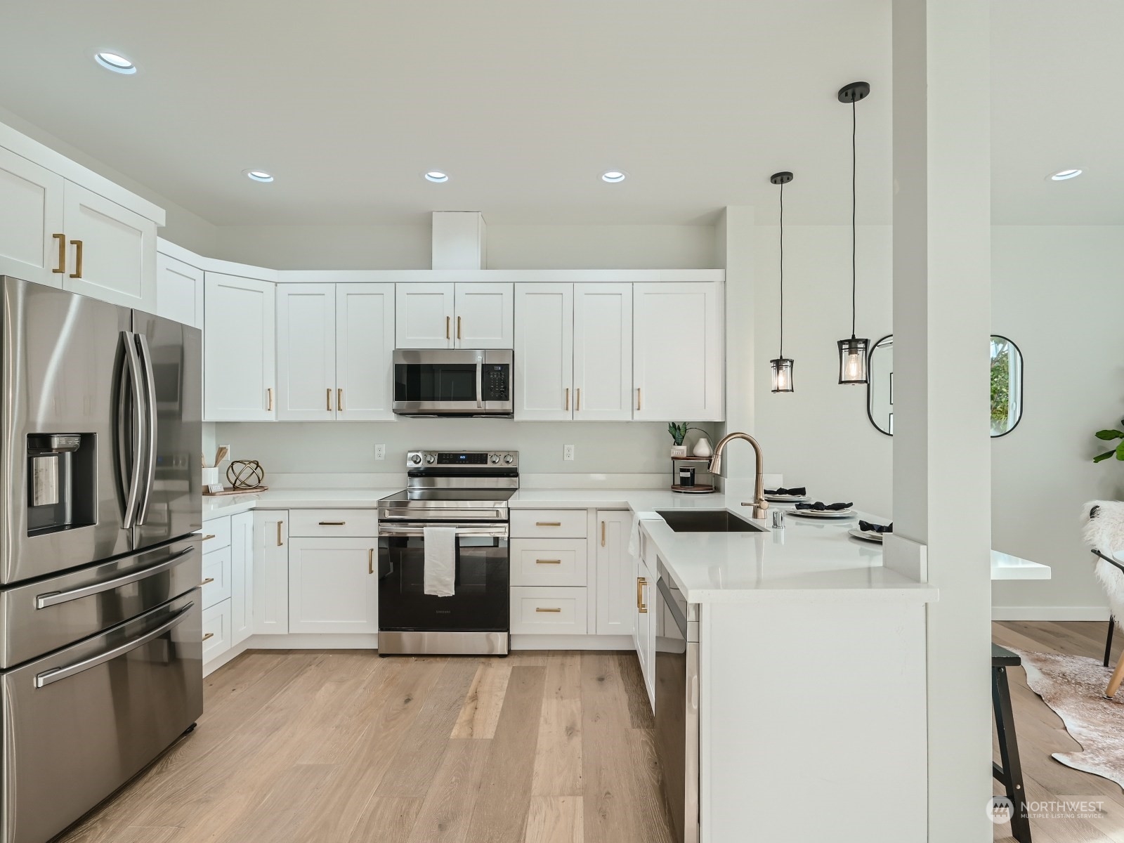 204 Date Avenue Sultan, WA 98294 - Photo 3 of 18 a kitchen with stainless steel appliances a stove sink refrigerator and cabinets