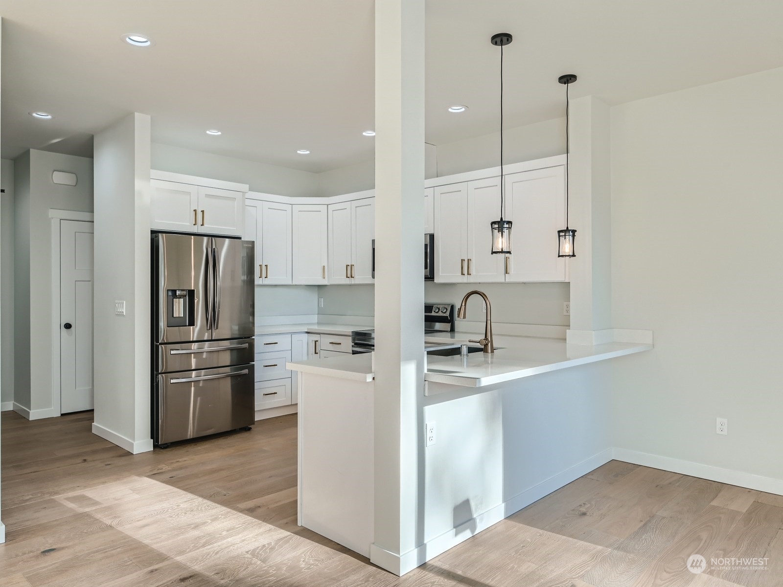 204 Date Avenue Sultan, WA 98294 - Photo 4 of 18 a kitchen with kitchen island a sink stainless steel appliances and refrigerator