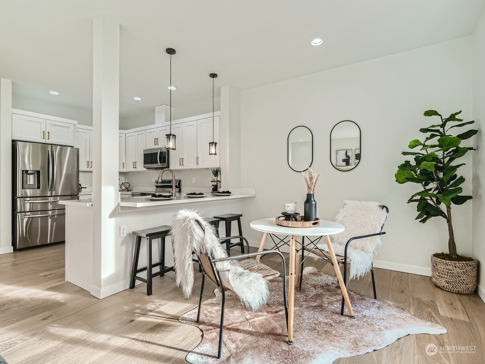 204 Date Avenue Sultan, WA 98294 - Photo 6 of 18 a kitchen with a table chairs refrigerator and cabinets