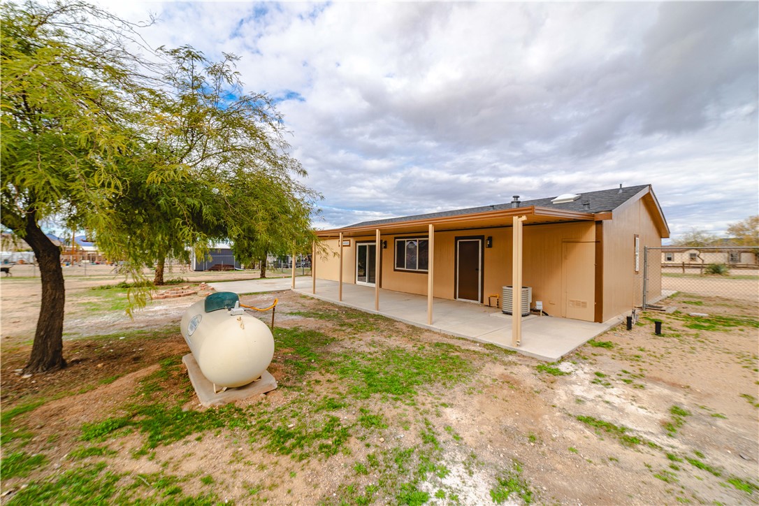 3248 West Carmichael Road Golden Valley, AZ 86413 - Photo 42 of 53 Rear view of house featuring a patio area