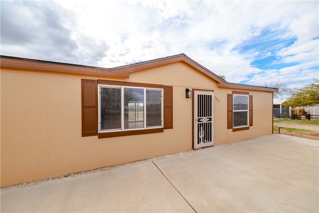 3248 West Carmichael Road Golden Valley, AZ 86413 - Photo 9 of 53 Back of house with a patio