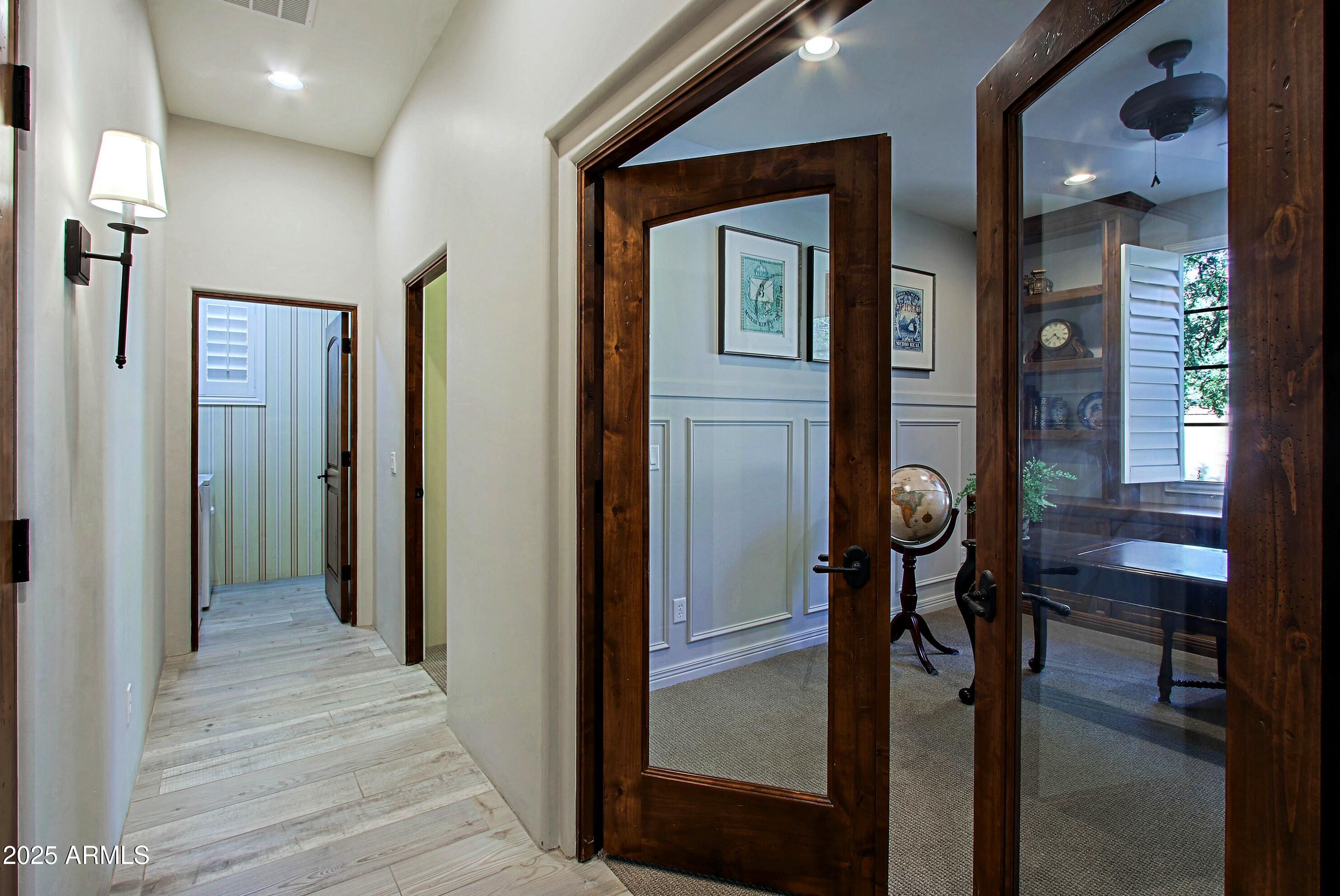 18650 North Thompson Peak Parkway, Unit 1052 Scottsdale, AZ 85255 - Photo 18 of 38 a view of a hallway to a livingroom and a dining room with furniture