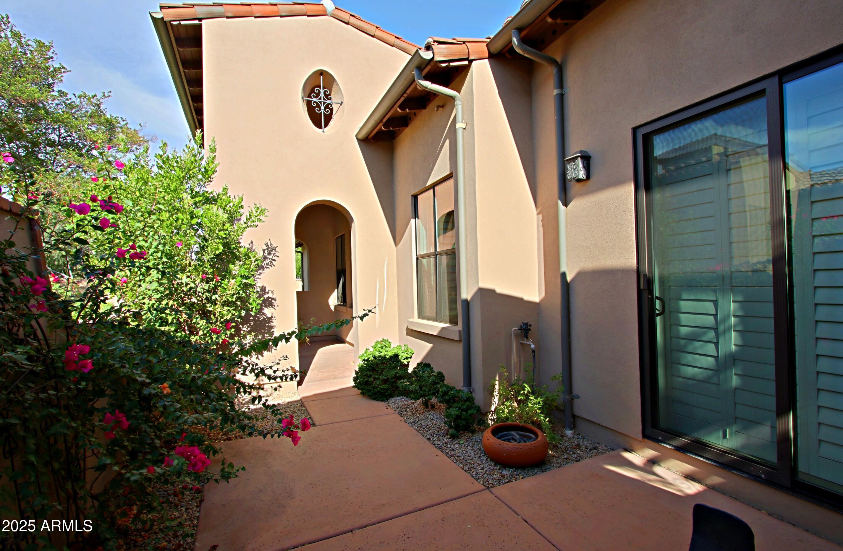 18650 North Thompson Peak Parkway, Unit 1052 Scottsdale, AZ 85255 - Photo 35 of 38 a front view of a house with a yard