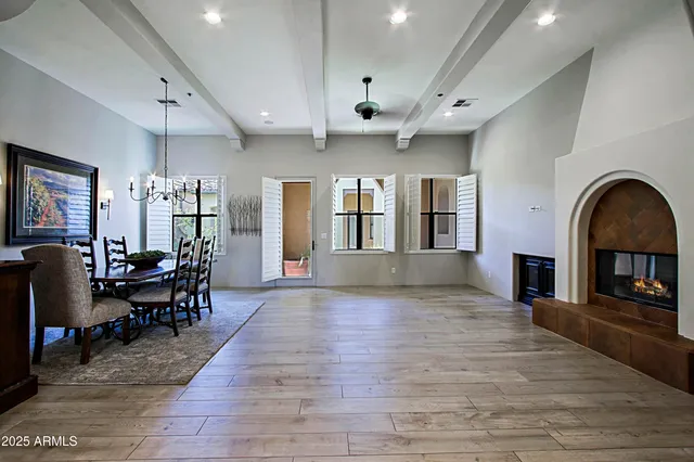 a view of a livingroom with furniture and a kitchen