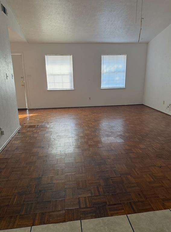 7417 Sorcey Road Dallas, TX 75249 - Photo 2 of 6 an empty room with windows