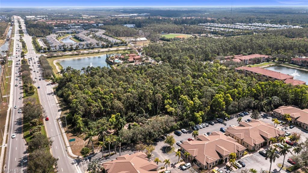 0 Davis Boulevard Naples, FL 34104 - Photo 3 of 4 an aerial view of a city with lots of residential buildings