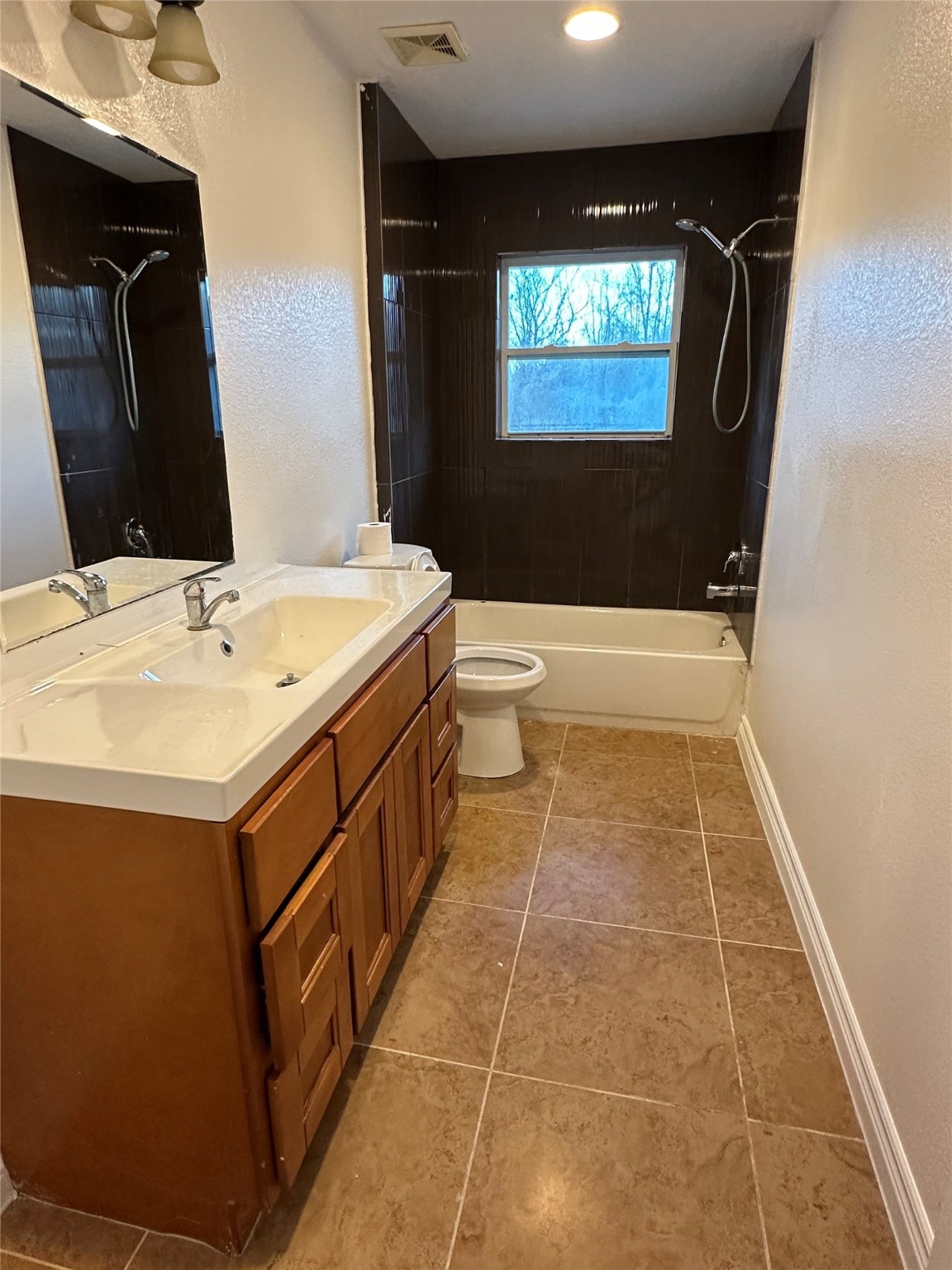 10412 Ehlers Road Conroe, TX 77302 - Photo 12 of 18 a bathroom with a sink a toilet and mirror