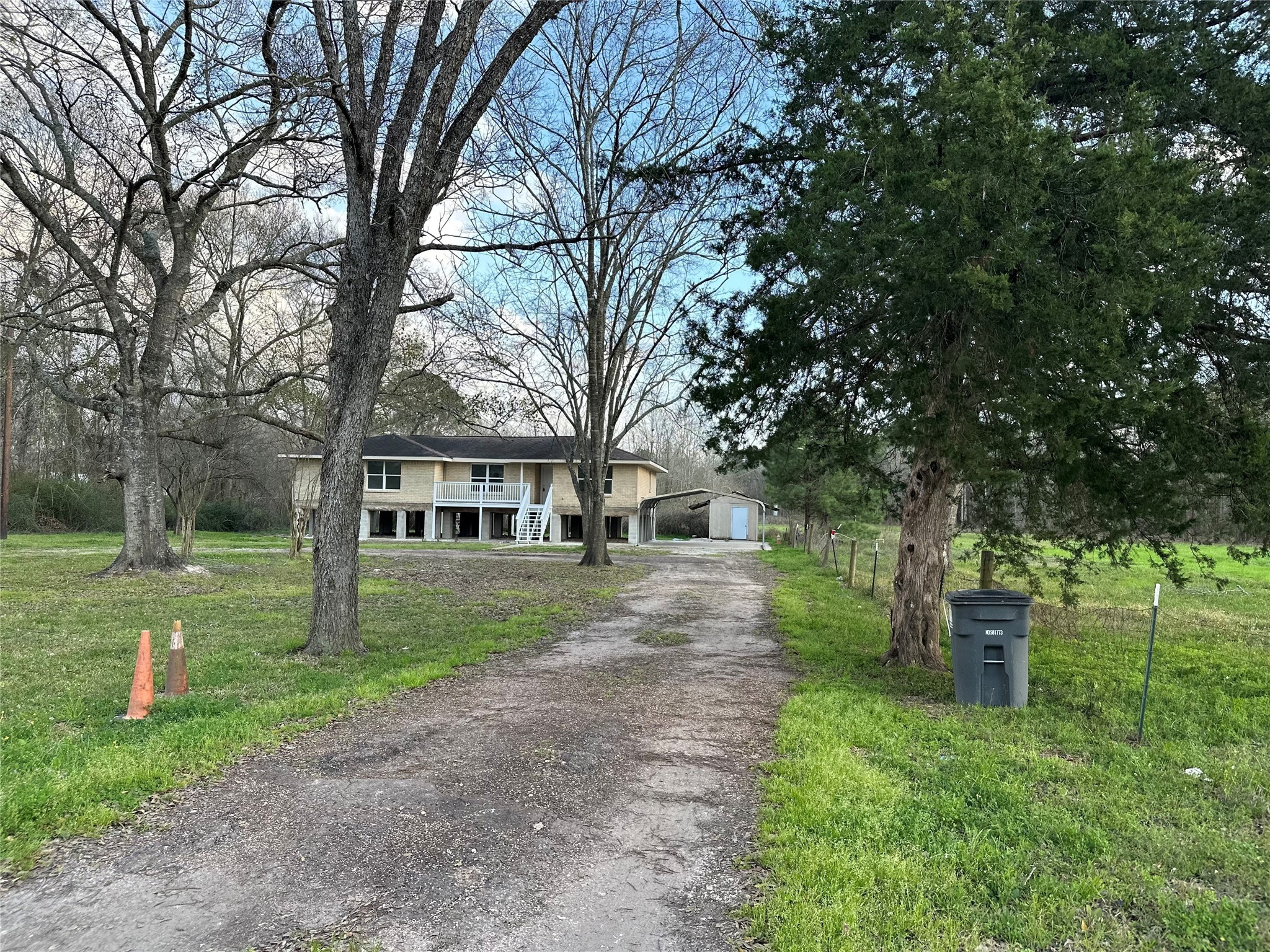 10412 Ehlers Road Conroe, TX 77302 - Photo 2 of 18 a view of a house with a yard
