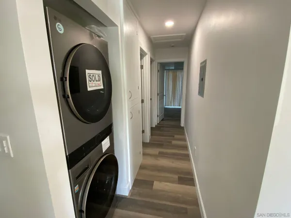 a view of a hallway with washer and dryer