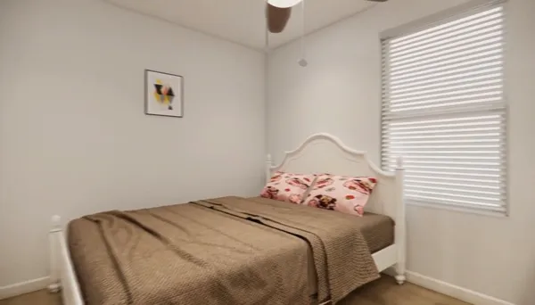 a bedroom with a bed and a window