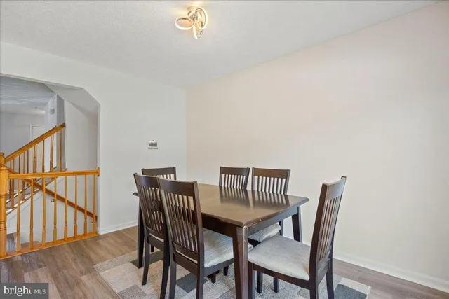 a view of staircase with rug