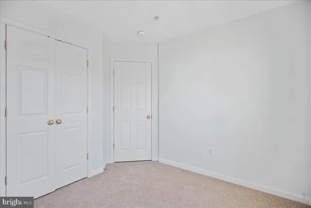 a bathroom with a sink a toilet and shower curtain